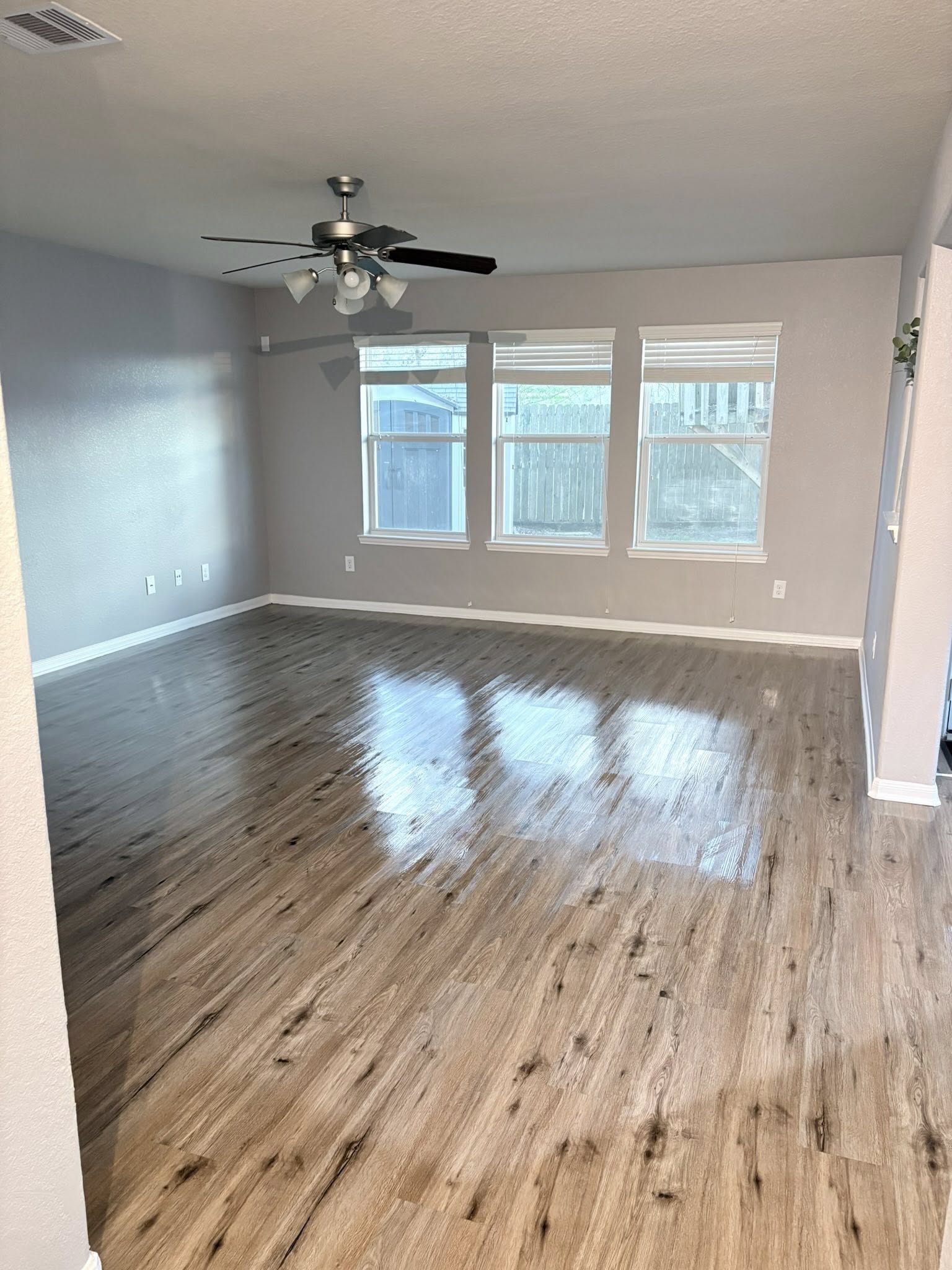 Freshly cleaned bedroom with organized bedding and clear surfaces